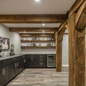 finish basement with a timber framed posts and beam
