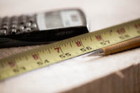 Tape measure, pencil, calculator used for timber frame layout